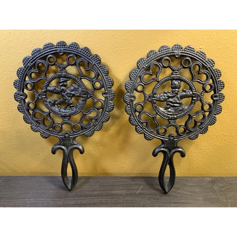 Two Fancy Vintage Cast Iron Trivets Black J.Z.H Amish Boy Girl 1952